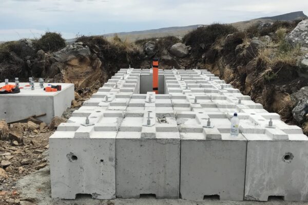 Concrete foundation blocks prepared on a remote hilltop site for tower installation and utility infrastructure works. The image shows civil construction, site preparation, foundation construction and concrete structure works managed by civil contractors in New Zealand.