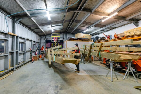Timber staircase components being prepared inside a workshop for recreation construction and walking track construction works. The image highlights civil construction, timber structures, structure construction and project management by civil contractors before site installation.