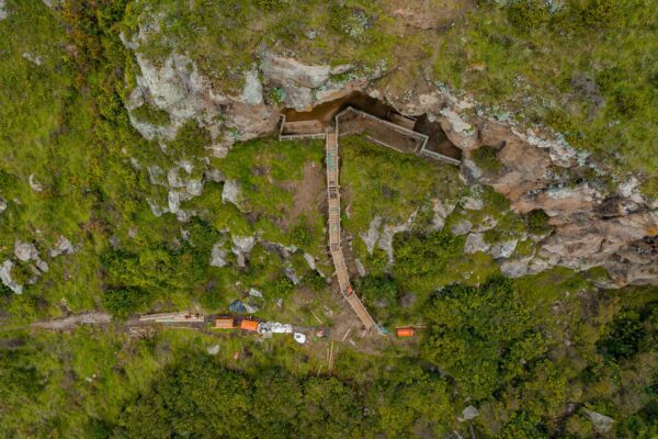 Overhead view of a timber staircase replacement leading up to a cave at Barnett Park, with siteworks visible along the steep hillside. This image highlights walking track construction, timber structures, recreation construction, park construction and project management by civil contractors.