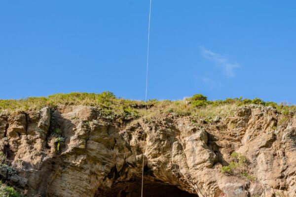 Helicopter operation lifting materials above the Barnett Park staircase replacement site, supporting walking track construction in steep difficult access terrain. The image shows heli operation, commercial sling work, recreation construction and project management by civil contractors.