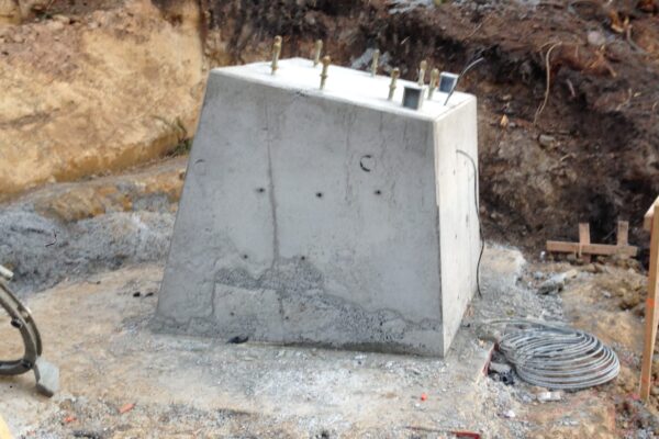 Completed concrete structure foundation for adventure infrastructure, with steel fixings ready for the next stage of structure construction. The image highlights civil construction, concreting company work, foundation construction and project management by civil contractors.