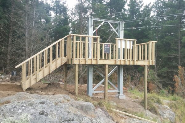 Timber structure platform built in a forest setting as part of recreation construction and adventure infrastructure works. The image shows civil contractors delivering park construction, structure construction, siteworks and foundation construction in a natural environment.