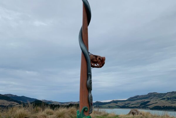 Completed pou installation on Quail Island overlooking the harbour, showing a finished cultural structure within a coastal recreation setting. The image highlights civil construction, structure construction, foundation construction, park construction and project management by civil contractors.