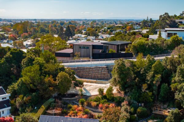 Completed retaining walls and civil construction works supporting a hillside residential development in Christchurch. The site shows project management, siteworks and foundation construction completed by HGM Construction, civil contractors in New Zealand.