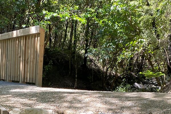 Panoramic view of a timber bridge and walking track through native bush, showing completed recreation construction and park construction works. This image highlights civil construction, timber structures, bridge construction and walking track construction by civil contractors.